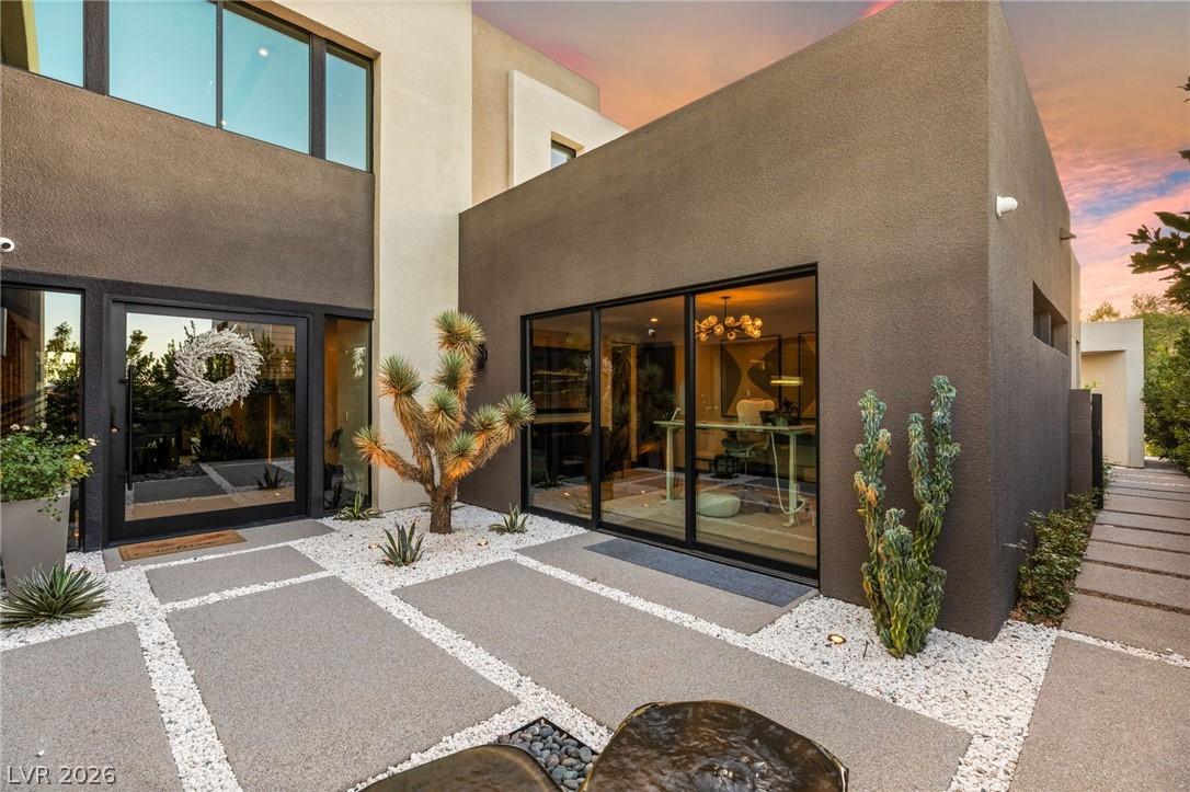 Image 3: Modern desert landscaping frames the grand entranc
