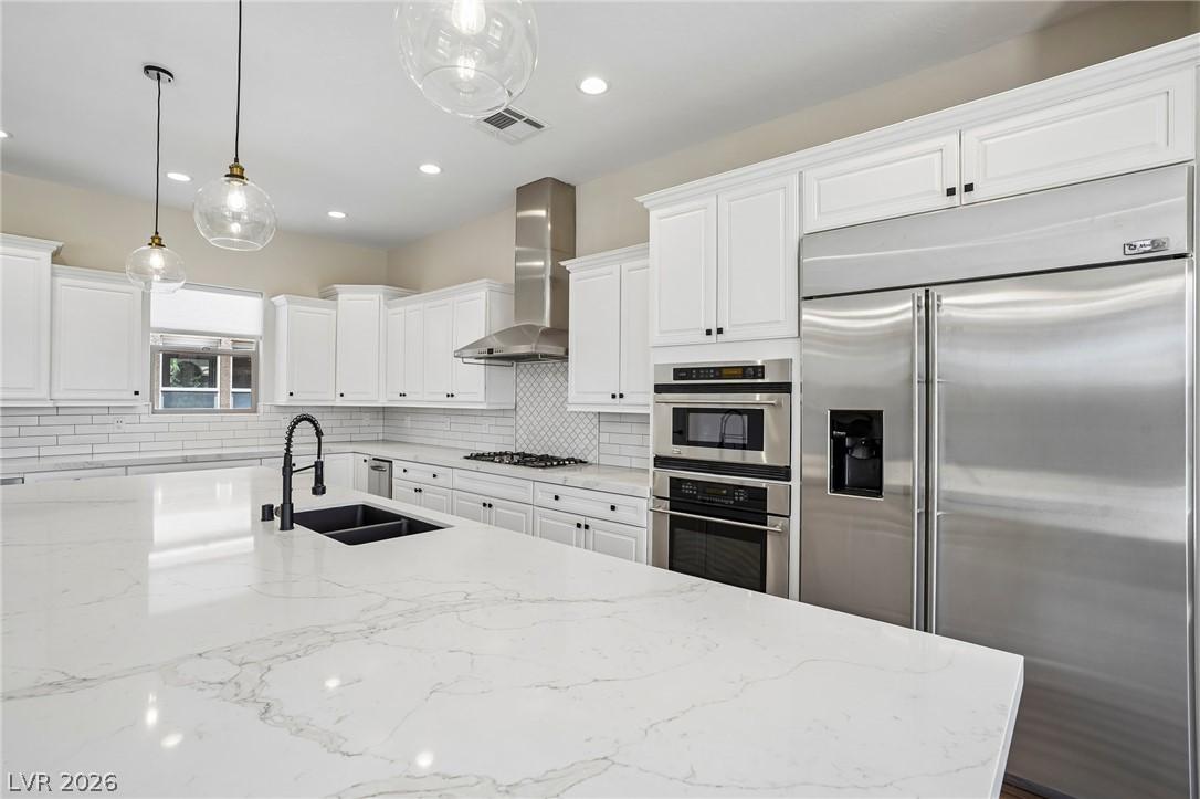 Image 3: Culinary delights await in this bright kitchen wit