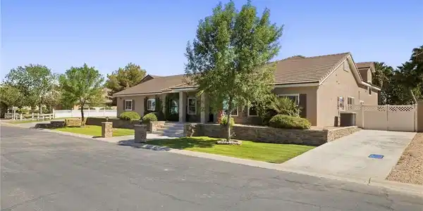 Image 2: A gracefully designed home with mature landscaping