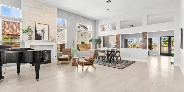 Image 3: Tall ceilings and abundant natural light create an