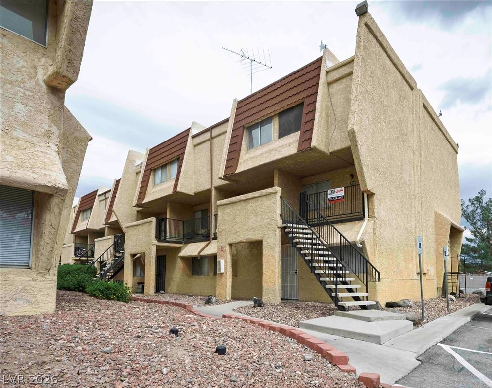 Image 1: View of property featuring stairs