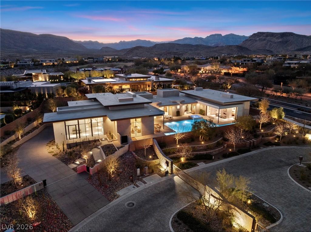 Image 1: An aerial twilight view reveals a luxurious modern