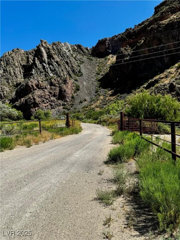 Image 3: View of dirt / gravel road featuring a mountain vi
