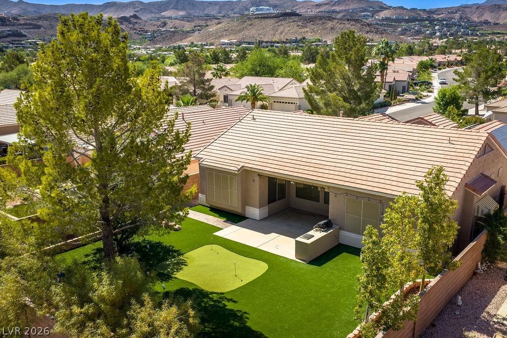 Image 2: An aerial view captures the home's exterior, offer