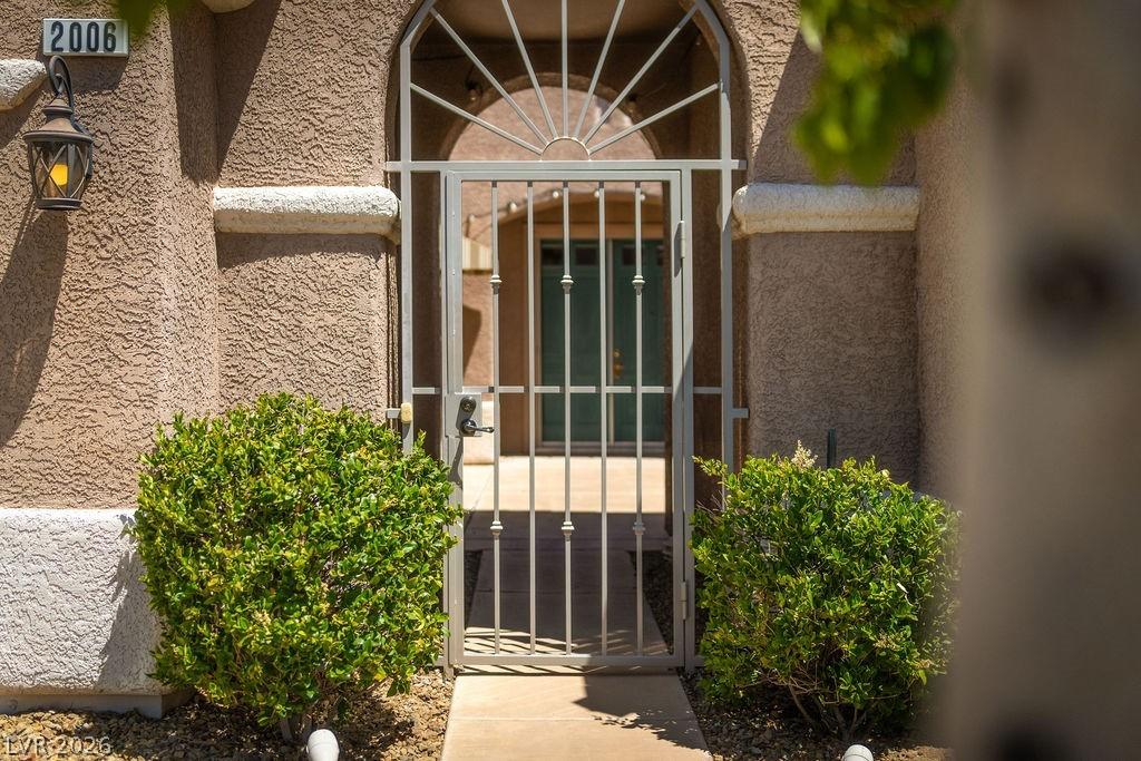 Image 3: This inviting entrance features an ornamental iron