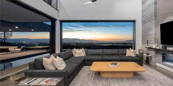 Image 2: A striking modern residence boasts an illuminated