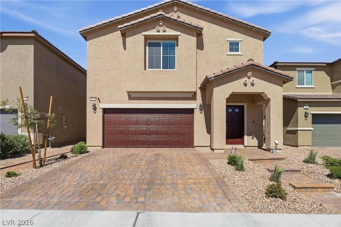 Image 2: A well-maintained facade features a paved driveway