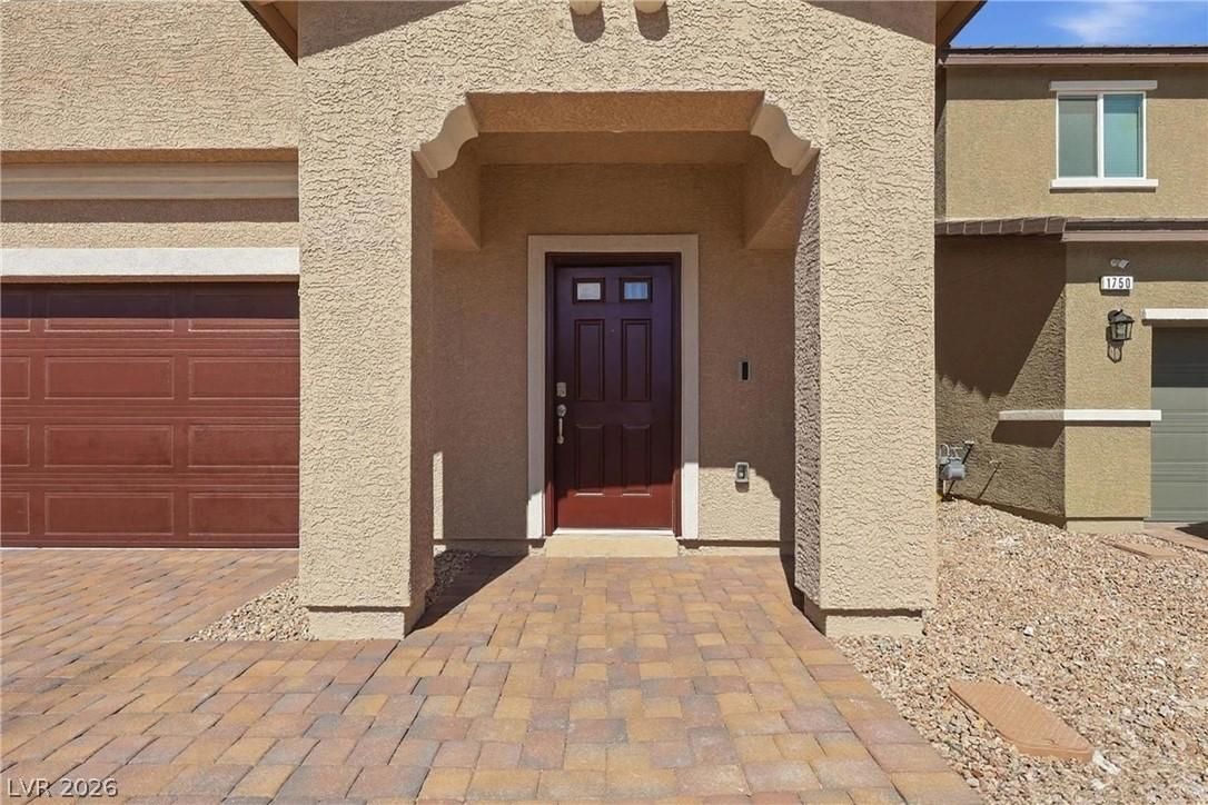 Image 4: A welcoming front entrance features an arched entr