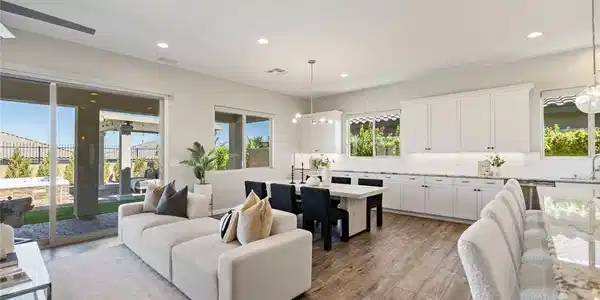 Image 3: Rich wood floors lay a warm foundation throughout