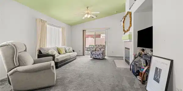 Image 3: Slanted ceilings and sliding doors leading outside