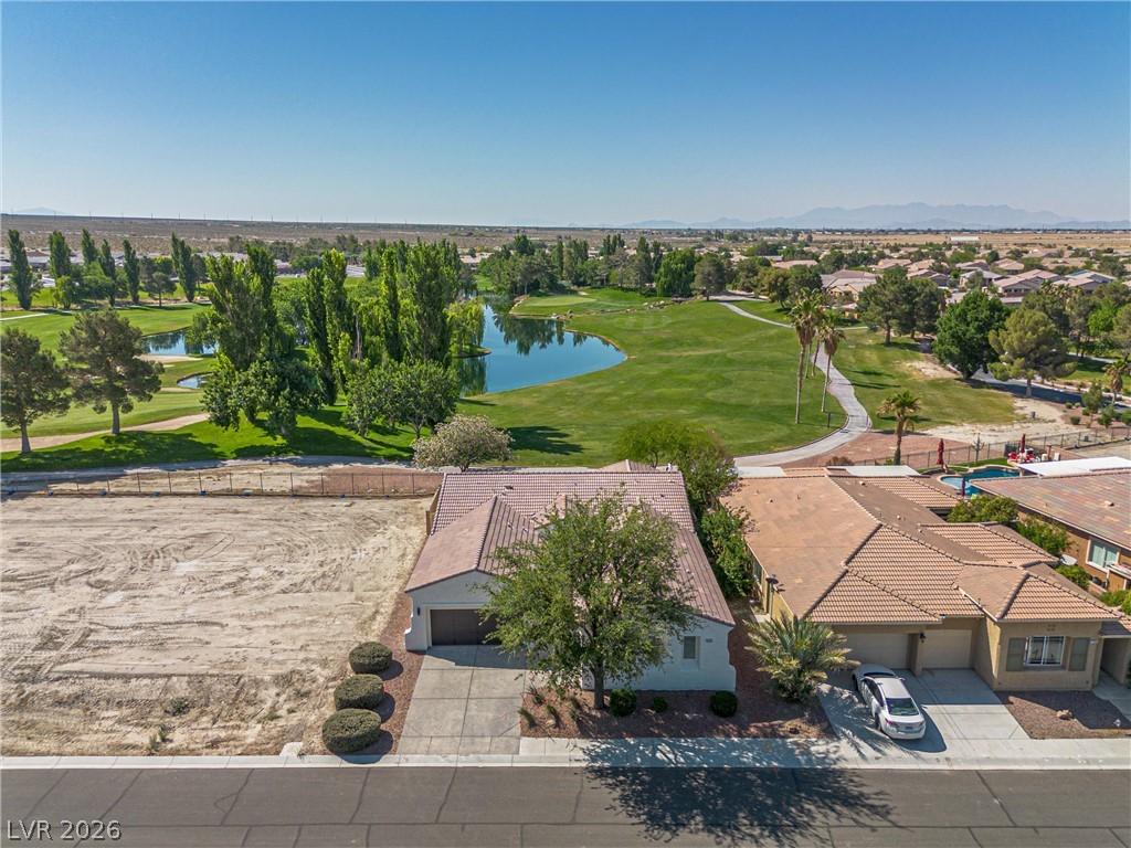 Image 2: Overlook the golf course and sparkling lake from t