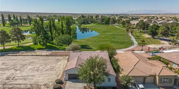Image 2: Overlook the golf course and sparkling lake from t