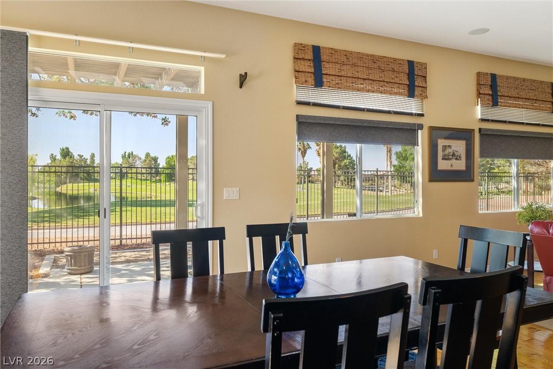 Image 4: A spacious dining area offers direct access to the