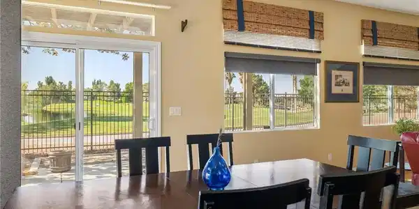 Image 4: A spacious dining area offers direct access to the