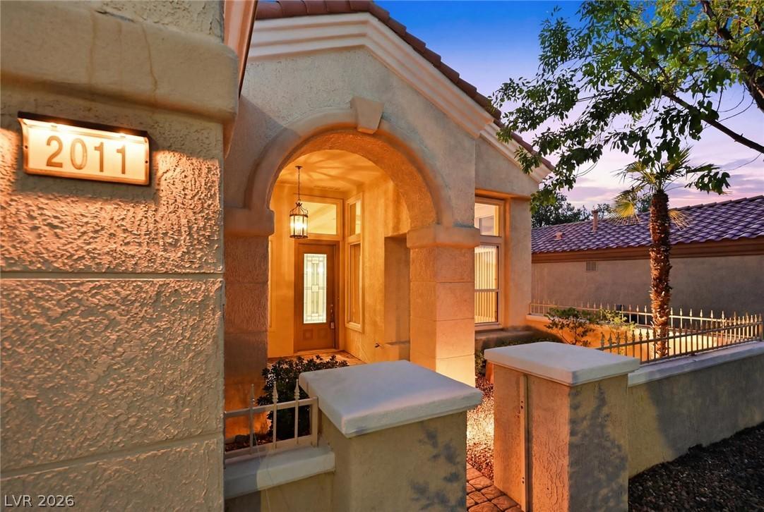 Image 4: An inviting entry archway and a welcoming front do