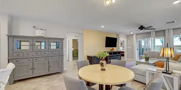 Image 4: Tiled flooring and recessed lighting flow through