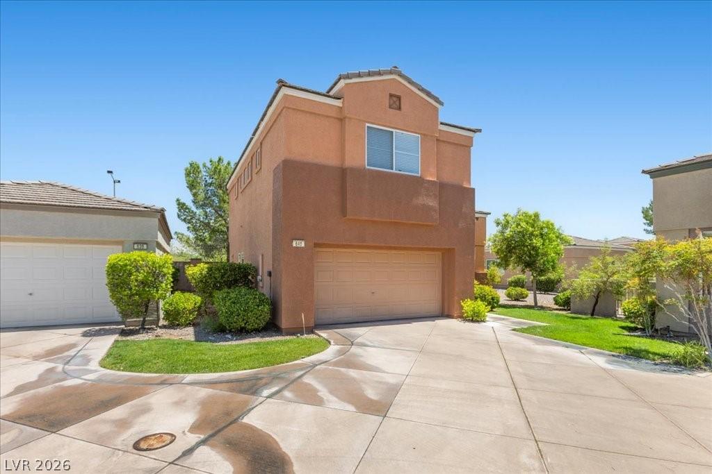 Image 2: This dwelling features a prominent two-car garage