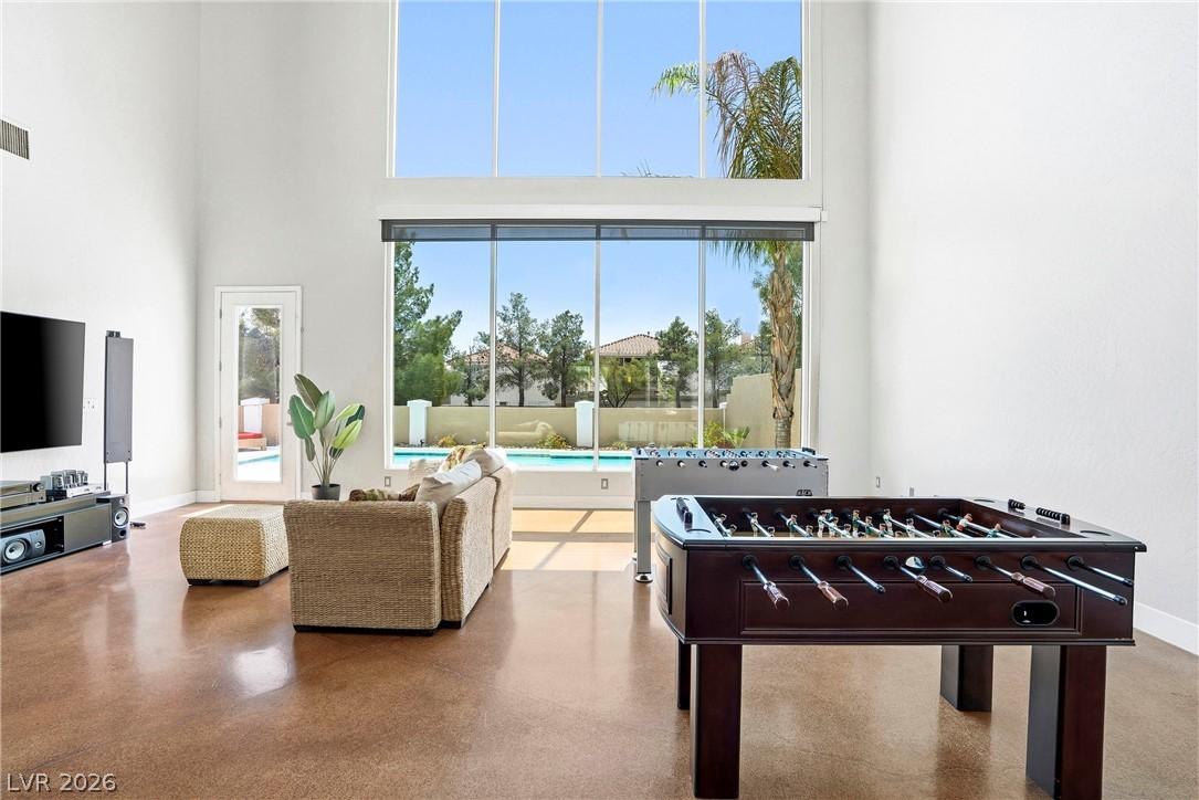 Image 2: Bright and airy living area with tall windows over