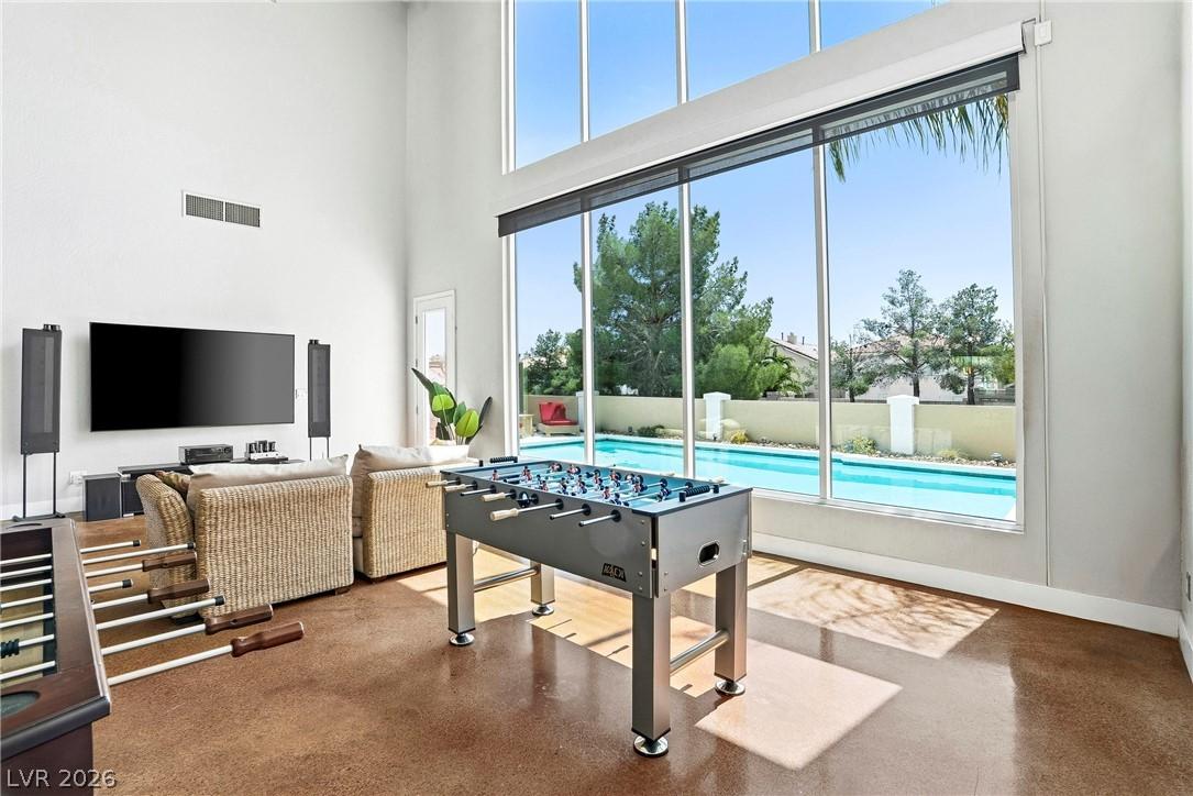 Image 3: This bright living space offers double high ceilin