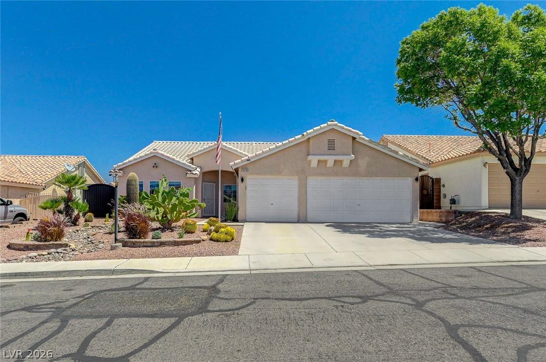 Image 2: This desert oasis features a two-car garage, matur