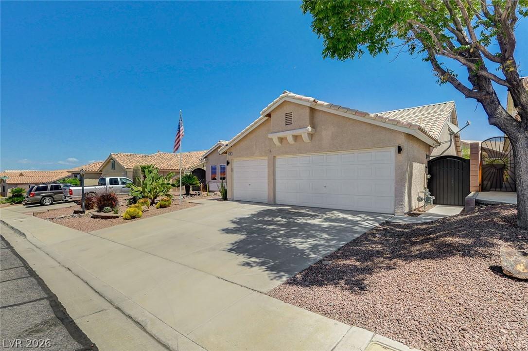 Image 4: This charming home offers a spacious driveway and