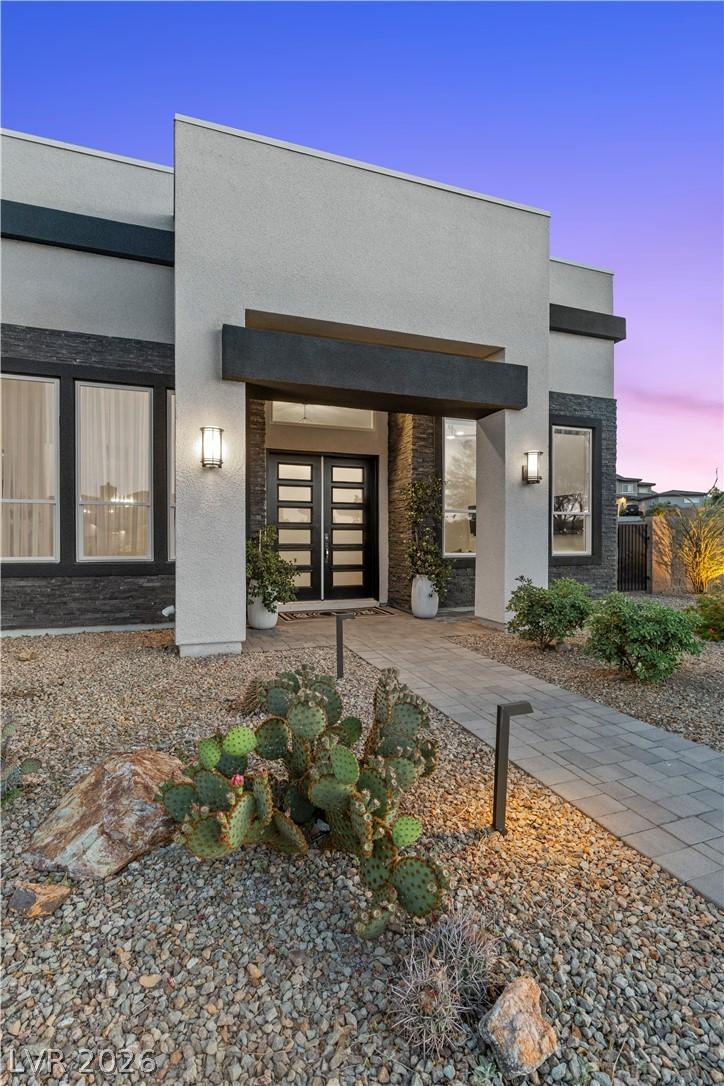 Image 4: The striking entrance features a clean-lined moder