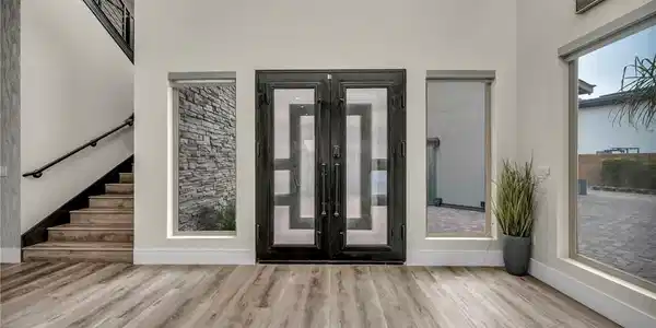 Image 4: Entrance foyer featuring french doors, wood finish