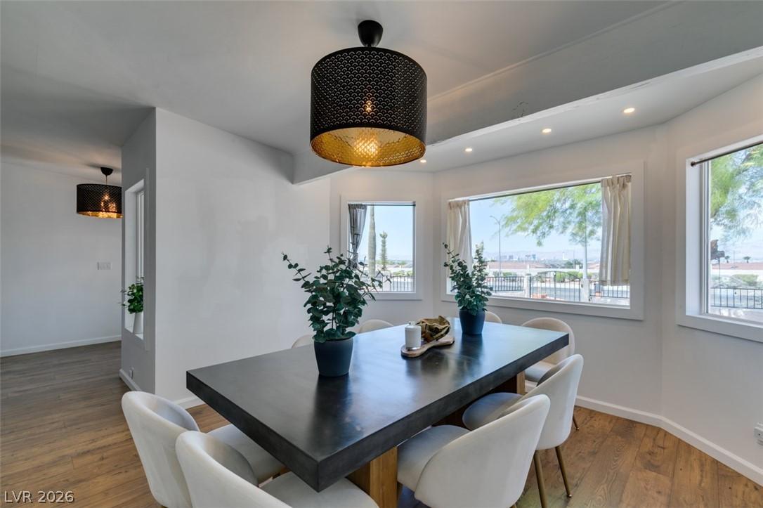 Image 1: This dining area boasts panoramic views, recessed