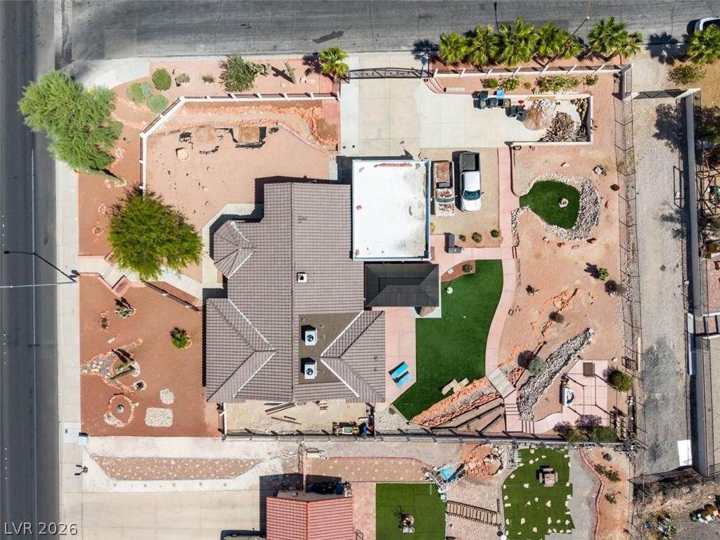 Image 2: This expansive property features a tile roof, pave