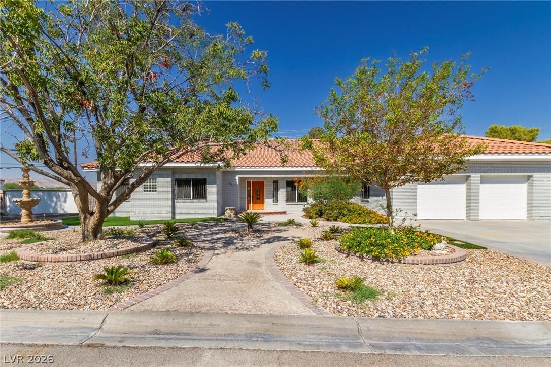 Image 1: This charming home offers a welcoming facade with