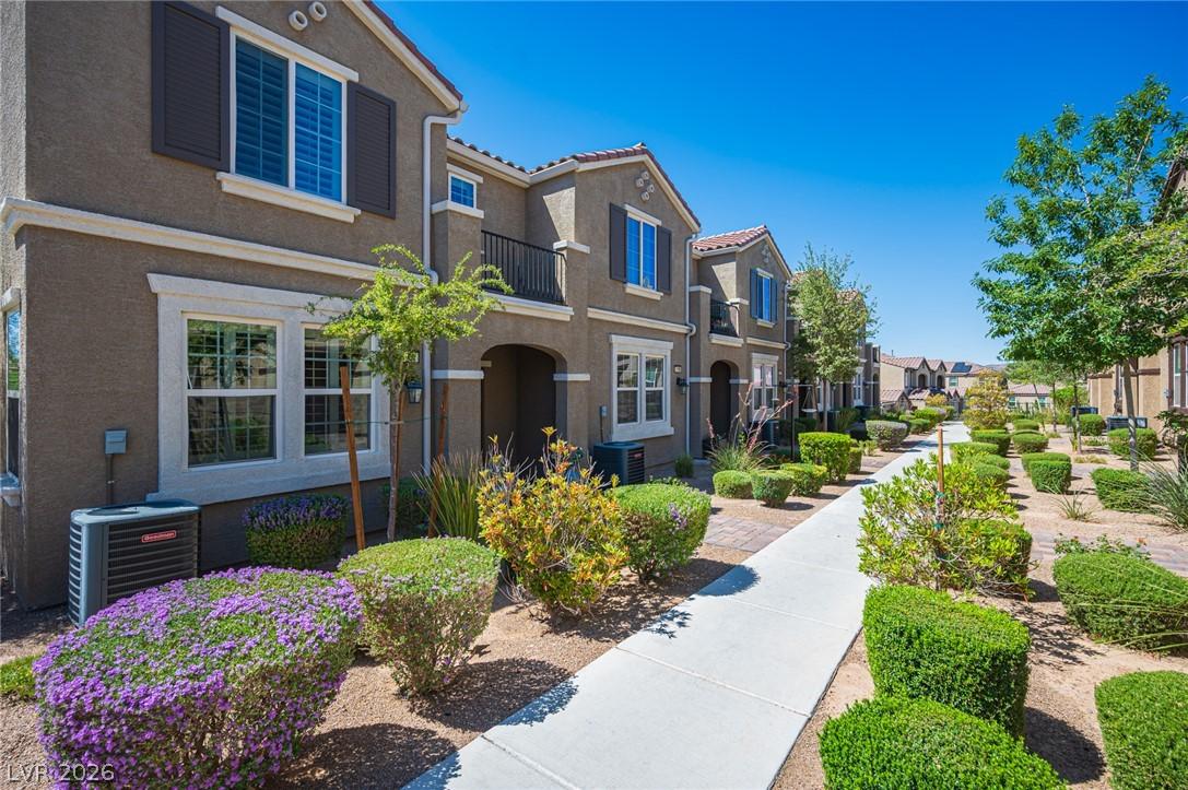 Image 3: A row of modern townhouses presents welcoming entr