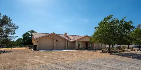 Image 2: A spacious home with a charming terracotta roof an