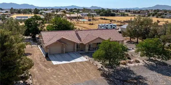 Image 3: An aerial perspective reveals a spacious residence