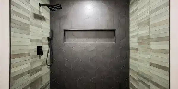 Image 2: A striking walk-in shower boasts geometric and lin