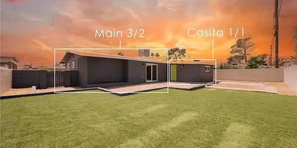 Image 4: A deep green lawn and sleek, modern architecture d