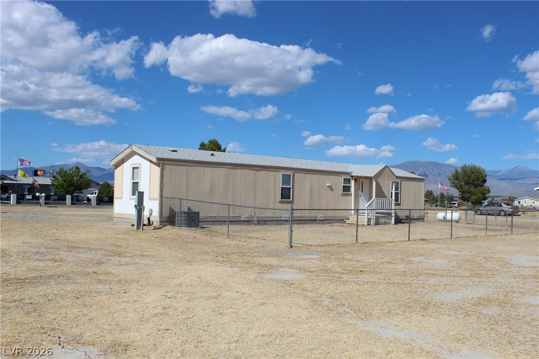 Image 3: This manufactured home offers a spacious lot with