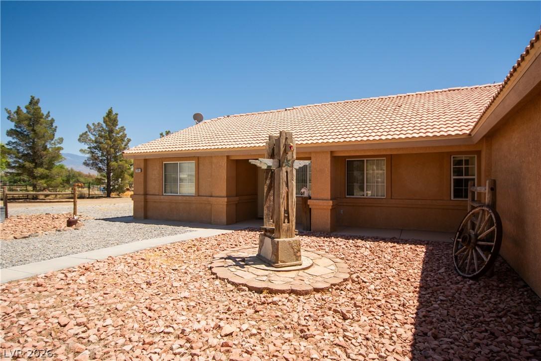 Image 3: This charming residence features an inviting exter