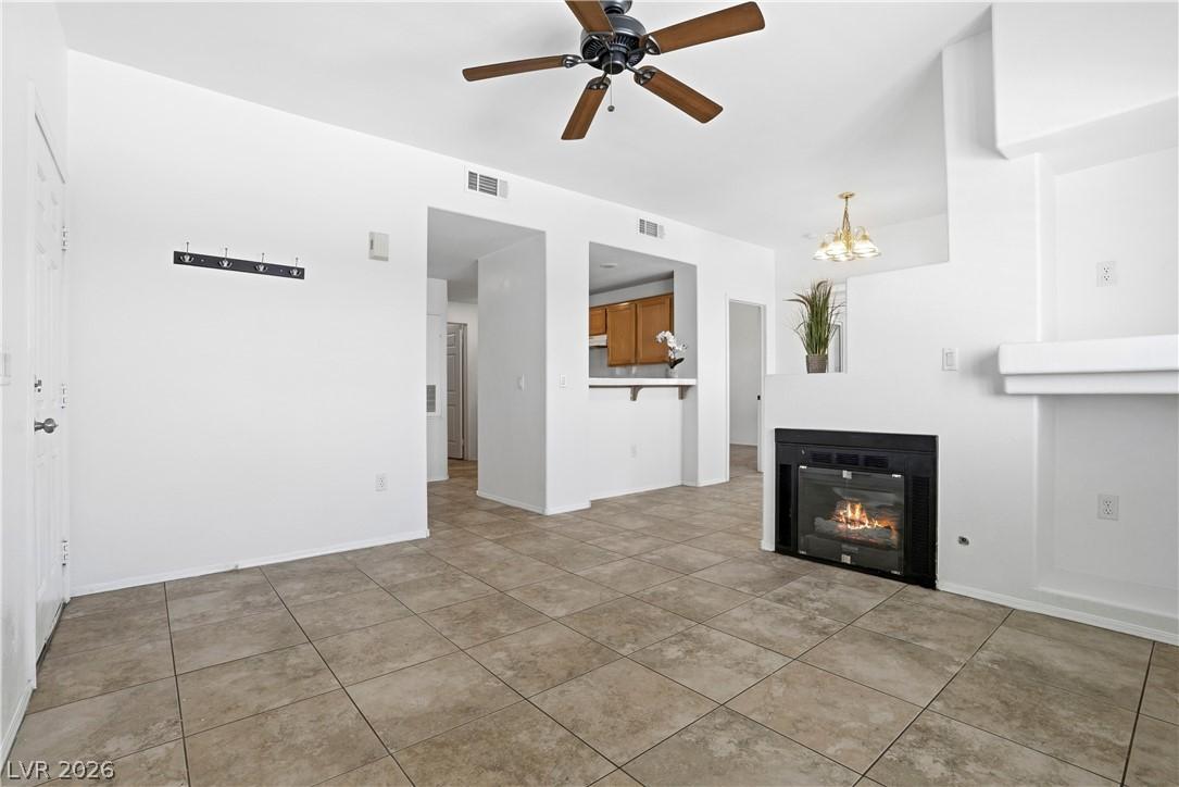 Image 3: This living room features a fireplace and offers a