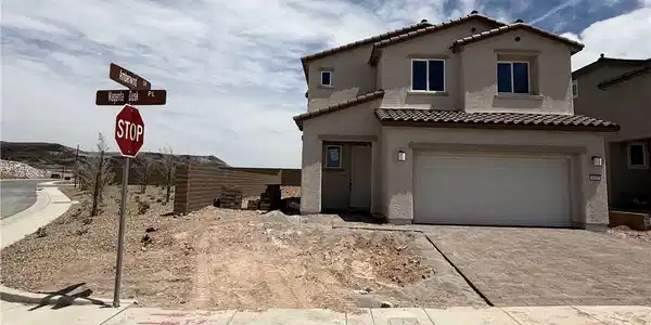 Image 3: This new construction home presents a welcoming fa