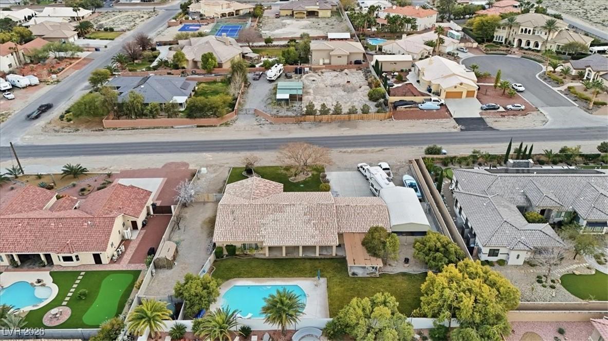 Image 4: Aerial perspective of suburban area with a pool