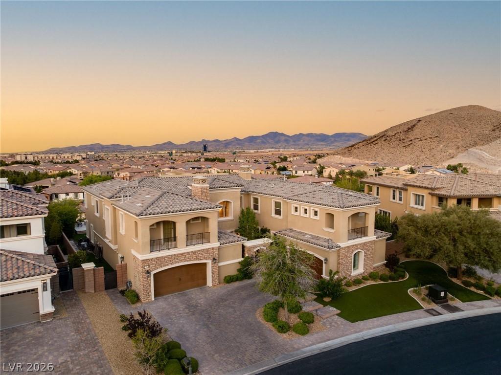 Image 1: This exquisite desert home features mountain views