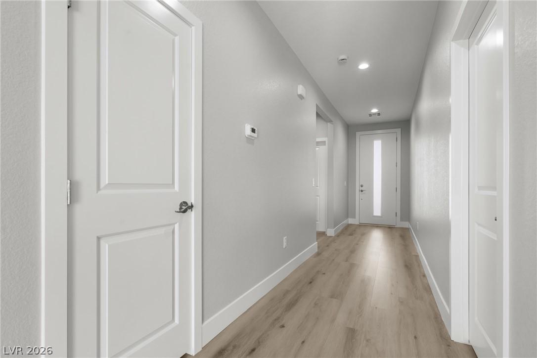 Image 3: Hall featuring light wood finished floors and rece