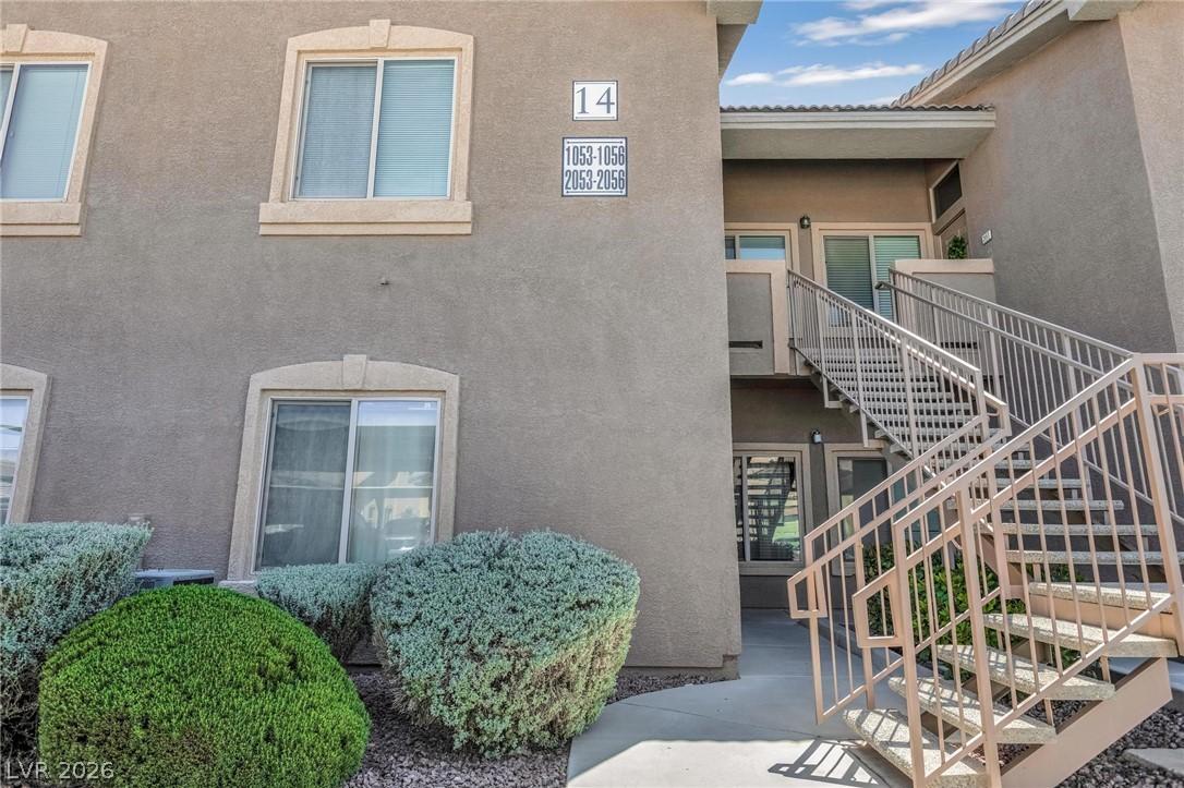 Image 3: This multi-story residential building features a m