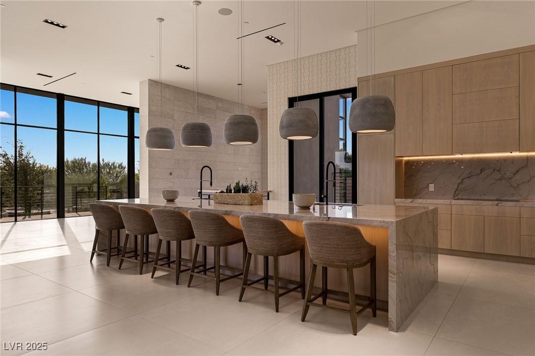 Image 3: Kitchen with modern cabinets, floor to ceiling win