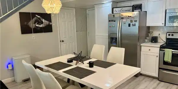Image 2: Dining area featuring light wood finished floors a