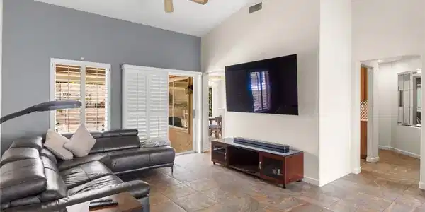 Image 2: Vaulted ceilings and tile flooring enhance this op
