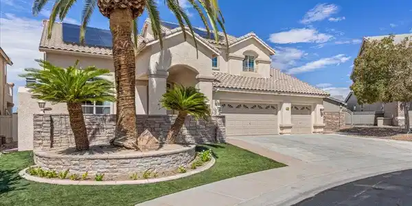 Image 4: Stately stucco architecture anchors this property