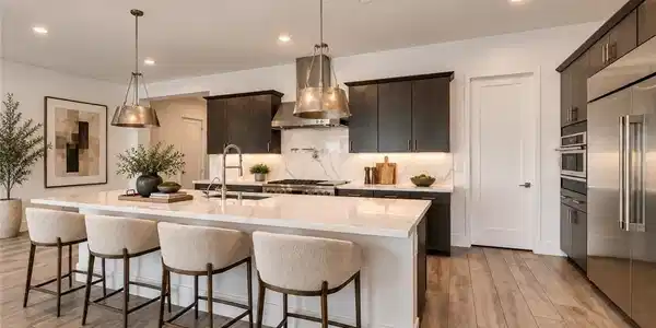 Image 2: An open kitchen design balances rich dark cabinetr