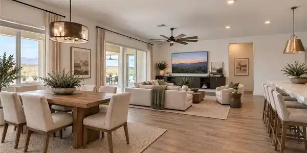 Image 3: An open floorplan seamlessly connects the dining a