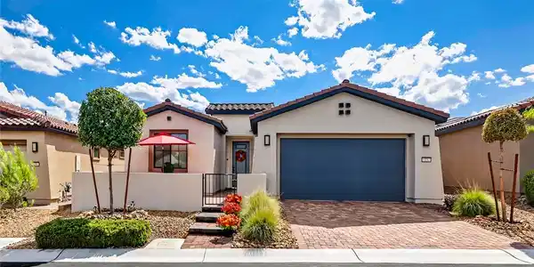 Image 2: Clean lines and a paved driveway define the exteri